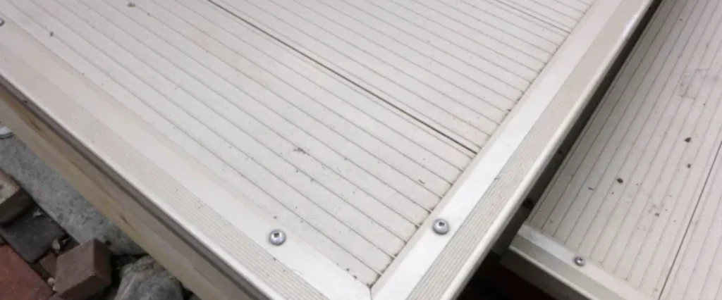 Waterproof decking boards with visible screw fasteners.