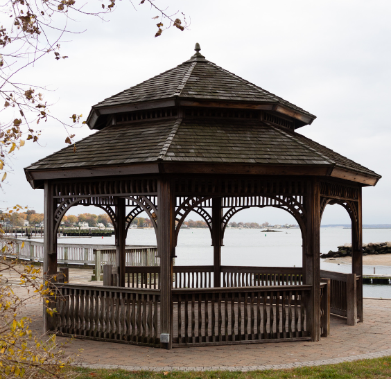 Wooden gazebo overlooking waterfront walkway