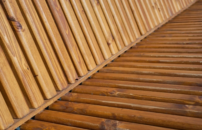 Wooden deck planks arranged in a diagonal pattern.