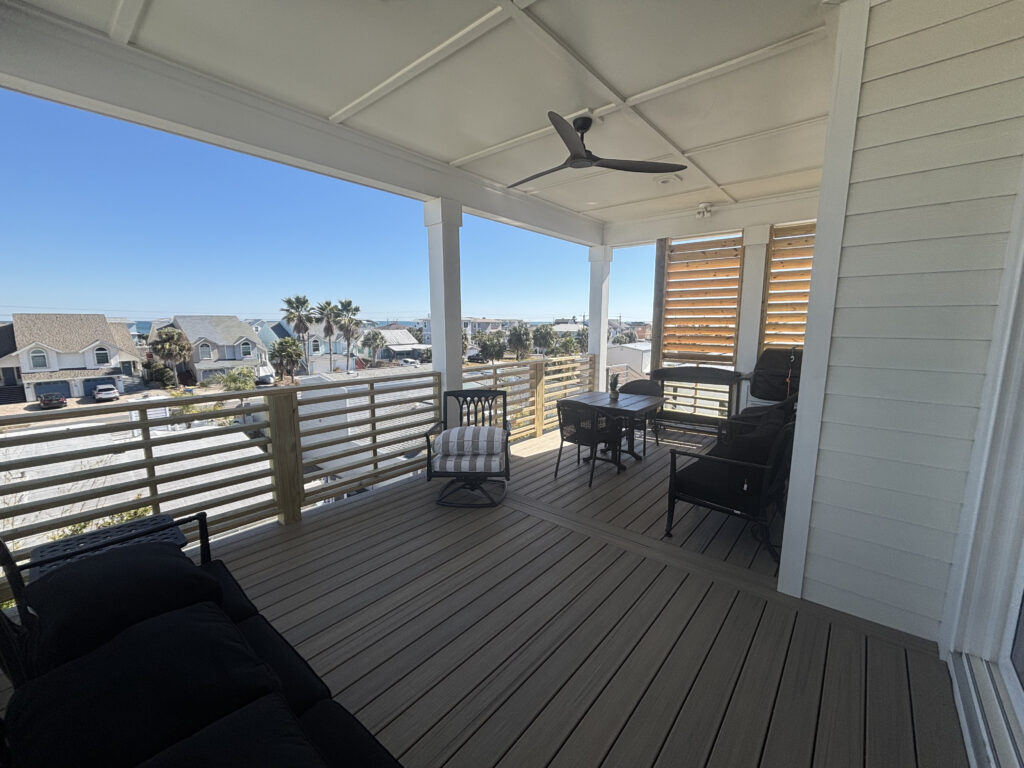 Coastal deck with seating and privacy walls.