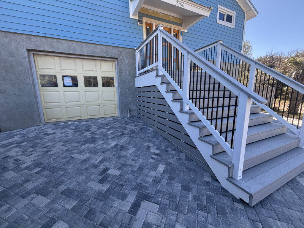 gray paver driveway with composite steps