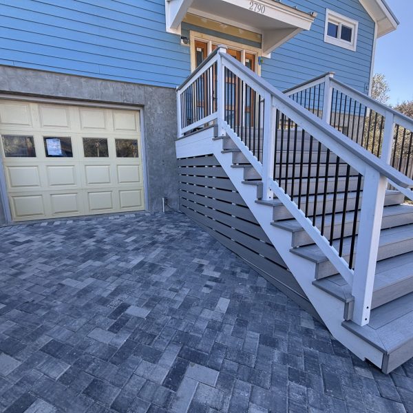 gray paver driveway with composite steps